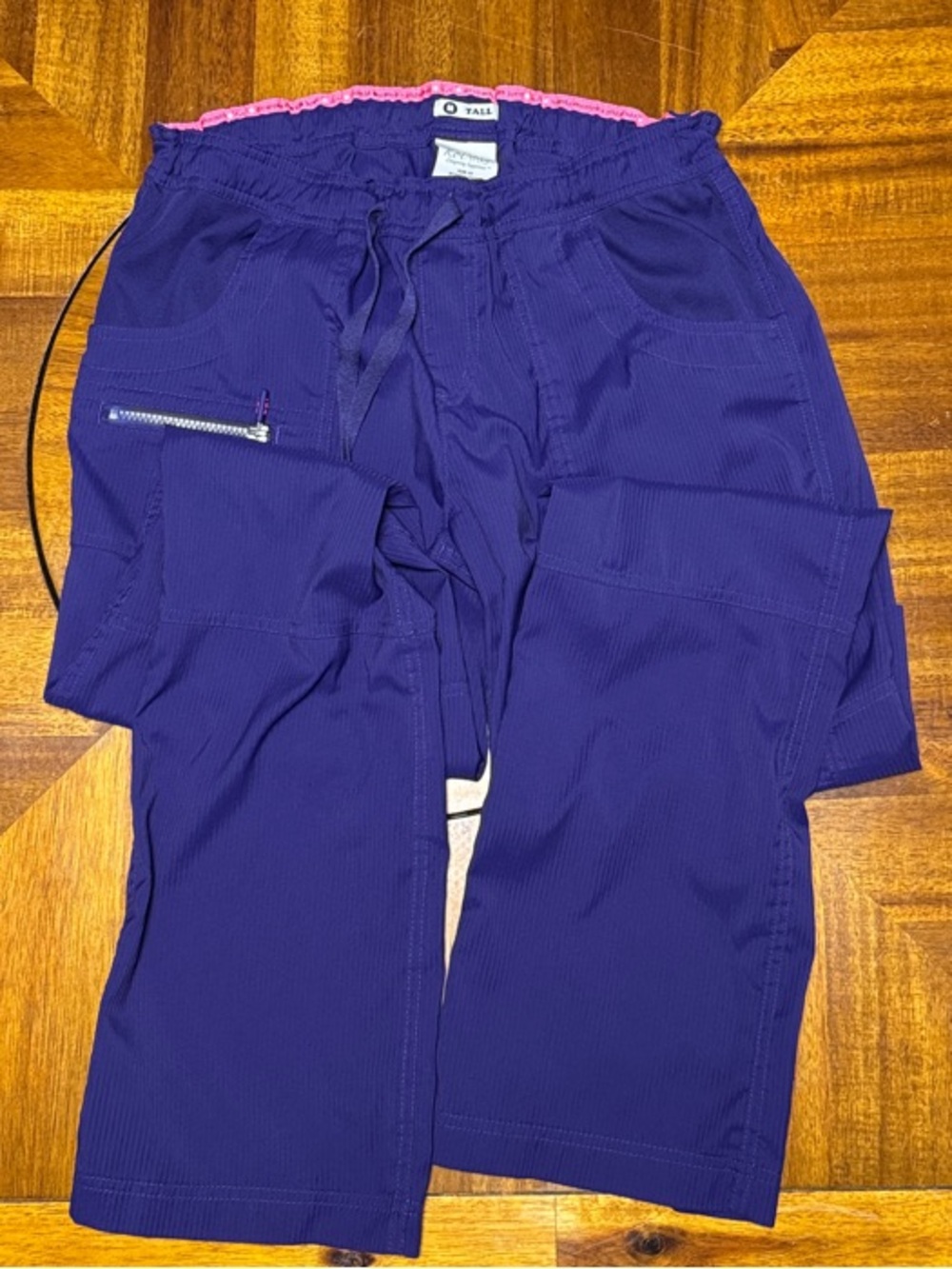 Koi lite Purple Boot-Cut Scrub Pants with Pink Waist Trim. Medium tall